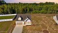 84 Hummingbird Grove Lane, Princeton, NC 27569 — 3-bedroom home in Graham's Place, Princeton, NC, photo 1 of 31: 001-497445-DJI_20261014150643_0233_D_twi