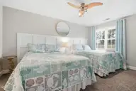 908 Resort Circle Unit 510, Sunset Beach, NC 28468 — 1-bedroom condo in Colony II, Sunset Beach, NC, photo 13 of 30: 2 queen beds in bedroom