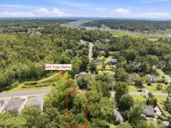 621 Vale Drive, Wilmington, NC 28411 — lot in Marsh Landing Place, Wilmington, NC, photo 1 of 16: 8-web-or-mls-DJI_20260909120722_0597_D c