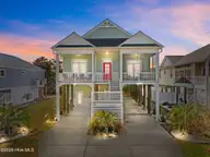 111 SE 44th Street, Oak Island, NC 28465 — 4-bedroom home in Long Beach, Oak Island, NC, photo 1 of 58: 1-web-or-mls-DJI_20260309150049_0177_D.j