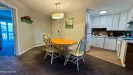 9201 Coast Guard Road E-101, Emerald Isle, NC 28594 — 3-bedroom waterfront condo in Pebble Beach, Emerald Isle, NC, photo 17 of 50: dining