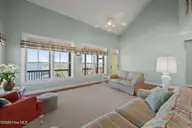 1711 E Fort Macon Road, Atlantic Beach, NC 28512 — 4-bedroom waterfront home in Asbury Beach, Atlantic Beach, NC, photo 6 of 42: Family room with view