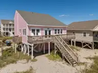 601 E Beach Drive, Oak Island, NC 28465 — 4-bedroom waterfront home in E. Long Beach, Oak Island, NC, photo 4 of 44: 7-web-or-mls-DJI_20250903144932_0373_D