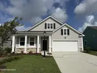 1285 Woodhouse Drive NW, Ash, NC 28420 — 3-bedroom home in Brunswick Plantation, Ash, NC, photo 1 of 31: Lot 41 - 1285 Woodhouse Drive NW