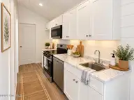 1580 Breezeway Drive SW, Ocean Isle Beach, NC 28469 — 2-bedroom home in Ocean Aire Estates, Ocean Isle Beach, NC, photo 15 of 19: Staged Kitchen
