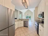105 Scallop Place, Goldsboro, NC 27530 — 3-bedroom home in The Reach, Goldsboro, NC, photo 1 of 26: Sunlit kitchen with clean stainless stee