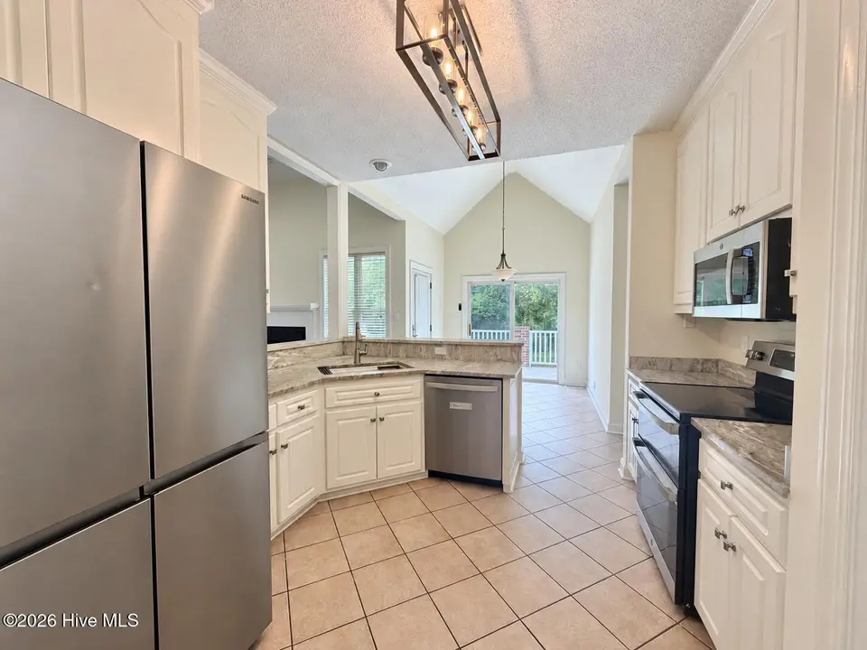 105 Scallop Place, Goldsboro, NC 27530 — 3-bedroom home in The Reach, Goldsboro, NC, photo 1 of 26: Sunlit kitchen with clean stainless stee