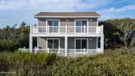 100 Conch Court, Emerald Isle, NC 28594 — 4-bedroom waterfront home in Sea Dunes, Emerald Isle, NC, photo 2 of 53: 1-web-or-mls-DJI_20251113150213_0941_D