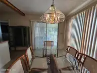 258 Hideaway Road, Belhaven, NC 27810 — 2-bedroom waterfront home in Sportsmans Hide-Away, Belhaven, NC, photo 20 of 48: 020 Dining room leads to large deck