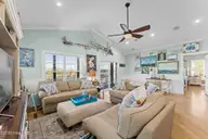 1404 W Yacht Drive, Oak Island, NC 28465 — 3-bedroom waterfront home in Pinners Point, Oak Island, NC, photo 10 of 46: Living room 3