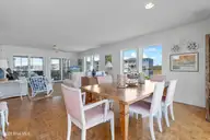 402 Dolphin Street, Sunset Beach, NC 28468 — 3-bedroom waterfront home, Sunset Beach, NC, photo 17 of 53: Dining Area with Water Views