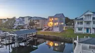 103 E Island Drive, Oak Island, NC 28465 — 3-bedroom waterfront home, Oak Island, NC, photo 2 of 76: 85_twilight