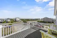 5127 W Beach Drive, Oak Island, NC 28465 — 5-bedroom waterfront home, Oak Island, NC, photo 16 of 73: 5_front porch