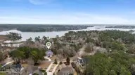 104 W High Bluff Drive, Hampstead, NC 28443 — 3-bedroom waterfront home in Pelican Reef, Hampstead, NC, photo 3 of 63: 56_dji_20260302111007_0016_d