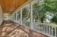 8660 River Road, Wilmington, NC 28412 — 5-bedroom waterfront home, Wilmington, NC, photo 23 of 65: Deck Area/View from Primary Bedroom