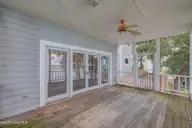 112 Coastal Bluffs Court, Hampstead, NC 28443 — 4-bedroom waterfront home in Olde Point, Hampstead, NC, photo 21 of 37: Screened Porch