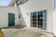 84 Crush Court, Swansboro, NC 28584 — 3-bedroom townhome in Pirates Cove Townhouses, Swansboro, NC, photo 23 of 29: Patio and Storage Room