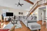 6707 Kings Lynn Drive, Oak Island, NC 28465 — 3-bedroom waterfront home in Kings Lynn, Oak Island, NC, photo 4 of 51: 6707 counch