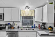 721 Blue Sail Drive SE, Bolivia, NC 28422 — 2-bedroom manufactured home in River Run Plantation, Bolivia, NC, photo 19 of 59: 17_kitchen