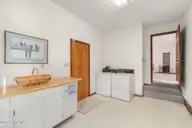 175 Cedar Lane, Newport, NC 28570 — 3-bedroom home in Gull Harbor, Newport, NC, photo 14 of 30: laundry room 1 into family room