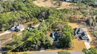 41 Yaupon Way, Oak Island, NC 28465 — 3-bedroom home in Oak Island Estates, Oak Island, NC, photo 2 of 43: 41YauponWayDrone-LotLines2