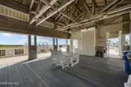 233 Sea Dreams Drive, Atlantic Beach, NC 28512 — 3-bedroom home in Sea Dreams, Atlantic Beach, NC, photo 13 of 68: clubhouse shaded area near pool