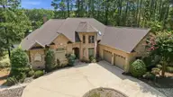 14 Kirkton Court, Pinehurst, NC 28374 — 4-bedroom waterfront home in Pinewild CC, Pinehurst, NC, photo 2 of 52: 4-web-or-mls-DJI_20260811120949_0299_D -