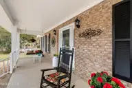618 Oyster Bay Drive, Sunset Beach, NC 28468 — 3-bedroom home in Sea Trail Plantation, Sunset Beach, NC, photo 5 of 62: Front Porch