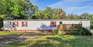 3215 Herthwood Place SW, Supply, NC 28462 — 3-bedroom waterfront manufactured home in West Tanglewood, Supply, NC, photo 1 of 36: Main Photo