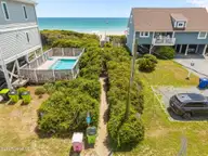 1625 S Shore Drive, Surf City, NC 28445 — 2-bedroom waterfront home in White Hills Beach, Surf City, NC, photo 3 of 32: 12-web-or-mls-DJI_20250729132737_0138_D