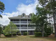 3350 Club Villas Drive # 405, Southport, NC 28461 — 2-bedroom condo in St James, Southport, NC, photo 4 of 39: Back
