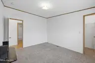 124 Zack Circle, Elizabeth City, NC 27909 — 3-bedroom manufactured home in Red Oak, Elizabeth City, NC, photo 23 of 36: Bedroom 2