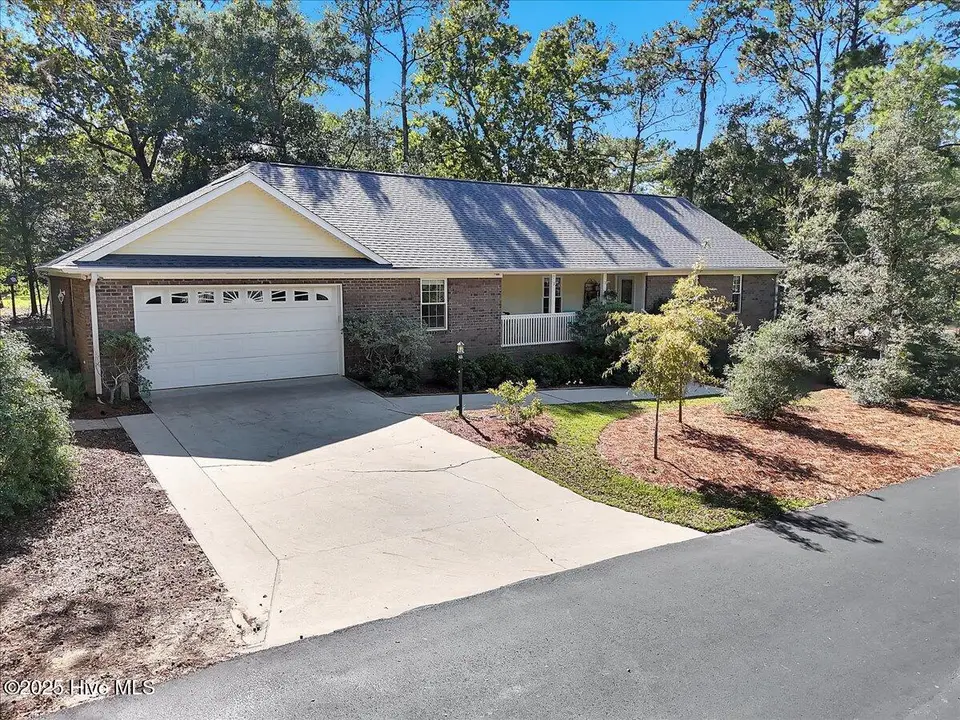3254 Island Drive SE, Bolivia, NC 28422 — 3-bedroom waterfront home in River Run Plantation, Bolivia, NC, photo 1 of 70: 75-Final Drone 3254 Island Dr SE Bolivia