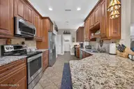 2037 Fanning Court, Leland, NC 28451 — 4-bedroom home in Waterford of the Carolinas, Leland, NC, photo 12 of 64: Kitchen
