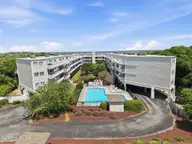 650 Salter Path Road 214, Pine Knoll Shores, NC 28512 — 2-bedroom waterfront condo in Ocean Bay Villas, Pine Knoll Shores, NC, photo 1 of 47: 1-web-or-mls-DJI_20260506121557_0193_D