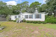 2587 Dockside Drive SW, Supply, NC 28462 — 3-bedroom waterfront manufactured home in Buccaneer Hills, Supply, NC, photo 1 of 29: 2587DocksideDrSW - 1