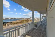 418 New River Inlet Road, North Topsail Beach, NC 28460 — 7-bedroom waterfront home in Royal Dunes, North Topsail Beach, NC, photo 6 of 62: Front Porch View