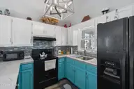 430 3rd Street, Sunset Beach, NC 28468 — 3-bedroom home, Sunset Beach, NC, photo 14 of 48: Undermount sink, solid surface counters
