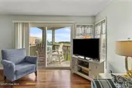 8801 Reed Drive 105 N, Emerald Isle, NC 28594 — 1-bedroom waterfront condo in Sound Of The Sea, Emerald Isle, NC, photo 10 of 37: Great Room