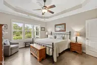 3014 Pine Bloom Way, Leland, NC 28451 — 4-bedroom home in Brunswick Forest, Leland, NC, photo 23 of 69: Primary bedroom with tray ceiling + fan