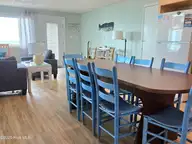 1103 Ocean Drive E & W, Emerald Isle, NC 28594 — 6-bedroom waterfront home, Emerald Isle, NC, photo 15 of 65: dining table