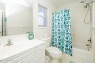 1131 S Shore Drive, Surf City, NC 28445 — 4-bedroom waterfront home in Horse Hammock, Surf City, NC, photo 17 of 40: Hall Bath with Tub