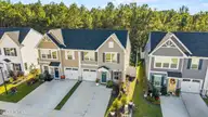 1483 Pine Log Trail NE, Bolivia, NC 28422 — 3-bedroom townhome in Middle Creek Village, Bolivia, NC, photo 1 of 34: Front View