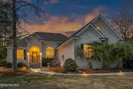 1148 Grandiflora Drive, Leland, NC 28451 — 3-bedroom waterfront home in Magnolia Greens, Leland, NC, photo 3 of 66: 1148GrandifloraDrive-3_Dusk