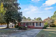 213 Woodland Drive, Wilmington, NC 28403 — 4-bedroom home in Pine Hills, Wilmington, NC, photo 1 of 40: 2_front exterior