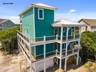 1202 N Topsail Drive, Surf City, NC 28445 — 4-bedroom waterfront home in Delmar Beach, Surf City, NC, photo 2 of 51: 13-web-or-mls-DJI_20250515142045_0351_D