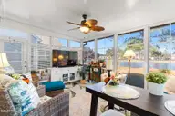 7568 Dunbar Drive SW, Sunset Beach, NC 28468 — 3-bedroom waterfront home in Sandpiper Bay, Sunset Beach, NC, photo 18 of 51: 4 Season Room
