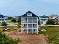 102 Marshland Circle, Newport, NC 28570 — 4-bedroom waterfront home in Cannonsgate, Newport, NC, photo 6 of 19: Rear Elevation