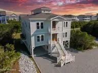 1 Bottlenose Boulevard, North Topsail Beach, NC 28460 — 6-bedroom home in Dolphin Shores, North Topsail Beach, NC, photo 1 of 56