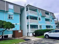 918 Carolina Beach Avenue N 2b, Carolina Beach, NC 28428 — 2-bedroom waterfront condo in A Place At The Beach, Carolina Beach, NC, photo 1 of 28: 918 CB Ave N 2B rear